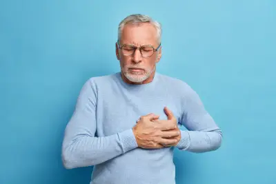 Blue background with a Senior man in spectacles presses hand to chest implying heart attack. Part of an article on future proofing your health
